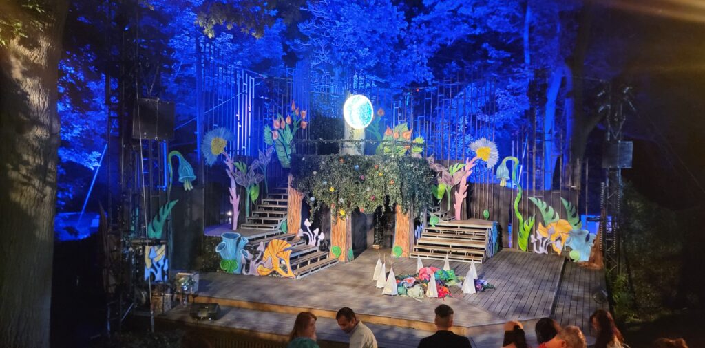 Outdoor stage and production at night for Shakespeare in the Park at High Park in Toronto