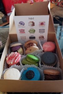 A box of nine different macaroons from "The Social Blend"