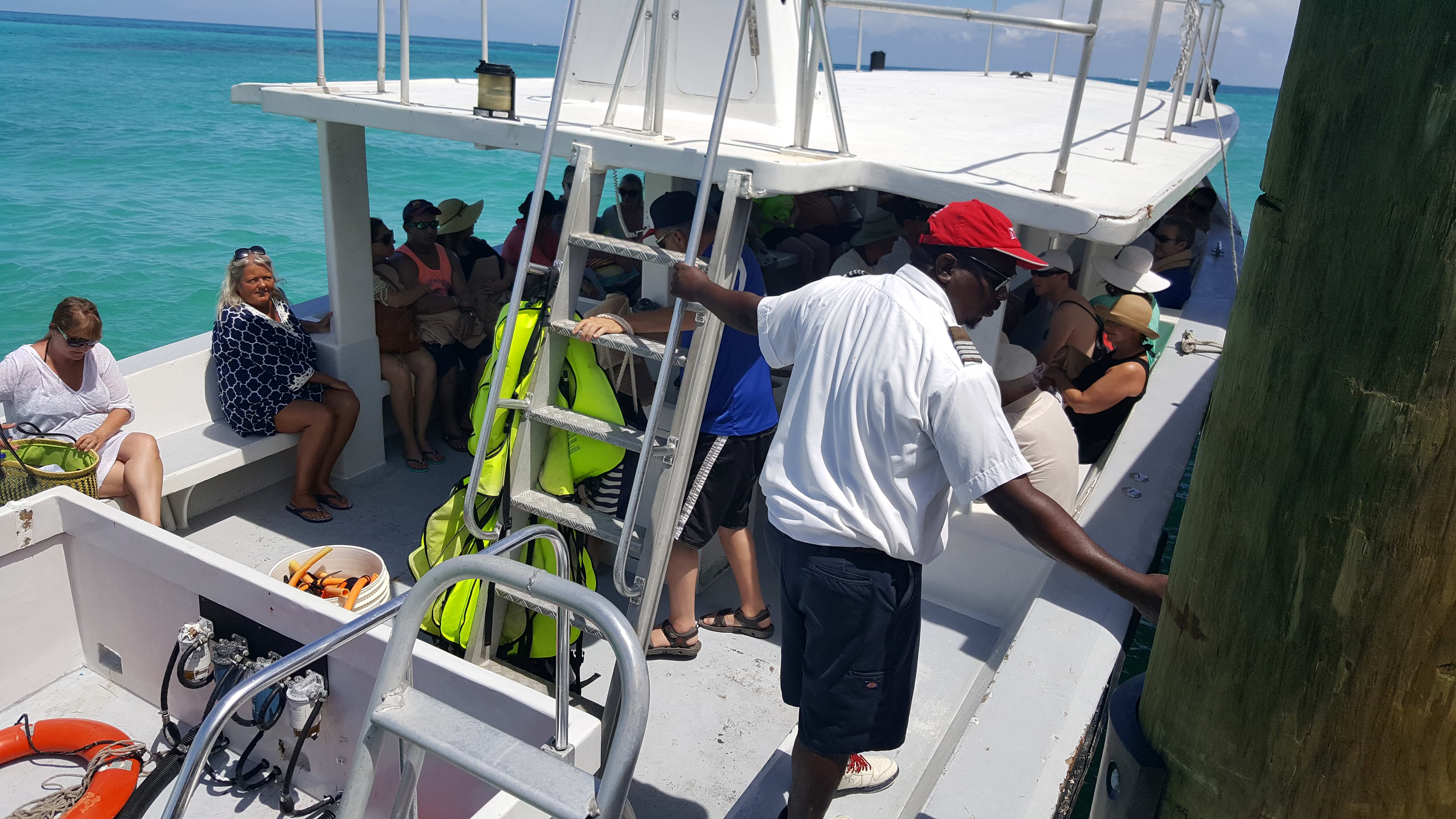 Boat with guests being taken from Sandals Royal Bahamian to the private offshore island, Barefoot Cay.