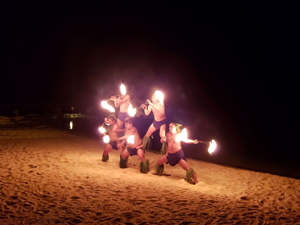 Five fire dancers on the beach in Moorea.