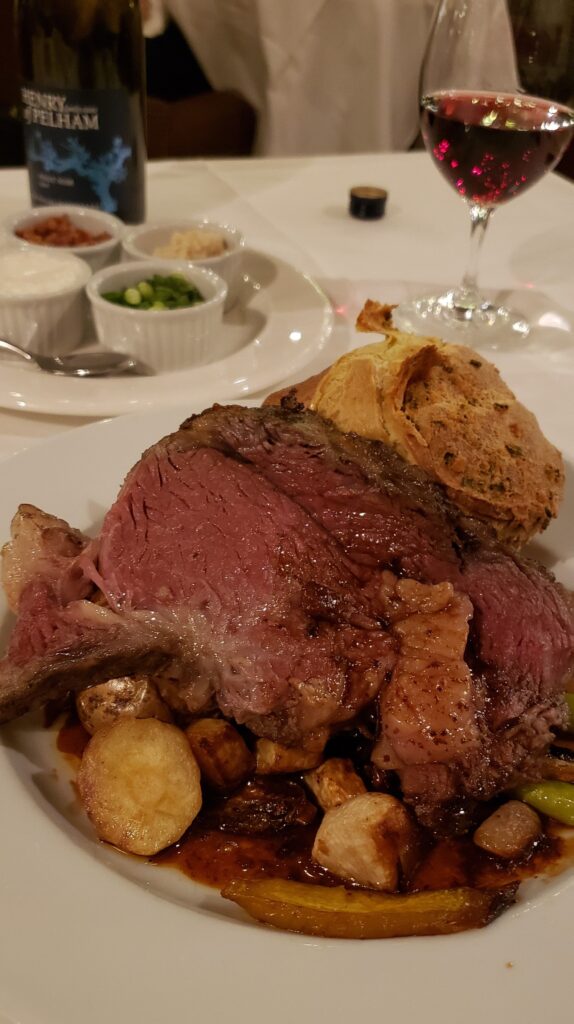 Close up of prime rib with potatoes with red wine from The Cannery in Niagara-on-the-Lake.