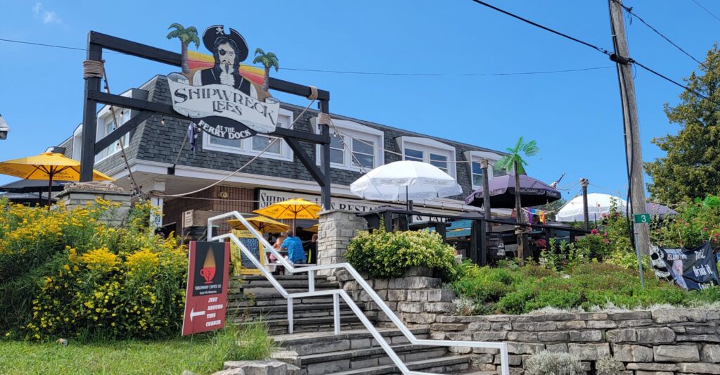 Exterior and patio of Shipwreck Lee's At the Ferry Dock where we ate in Tobermory