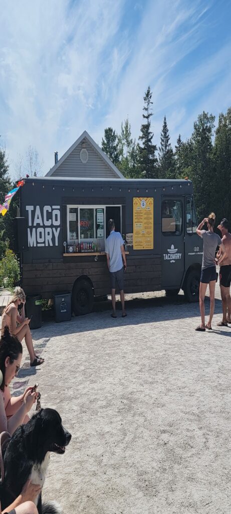 People ordering and waiting for their food at the Tacomory Food Truck