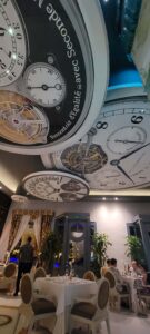 Interior picture, with clock decor in the ceiling, at one of the al a carte restaurants, Le Tourbillon, at the Iberostar Grand Bavaro.