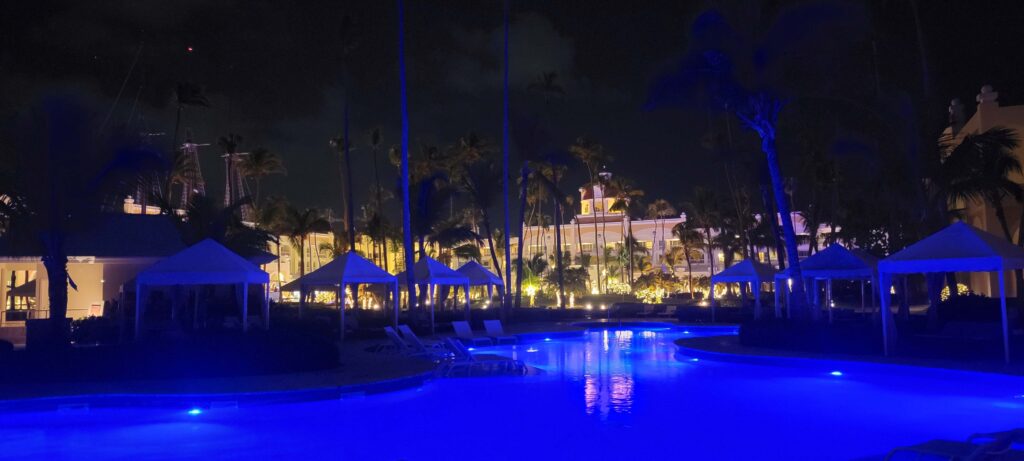 Pool and cabanas at Iberostar Grand Bavaro hotel at night 