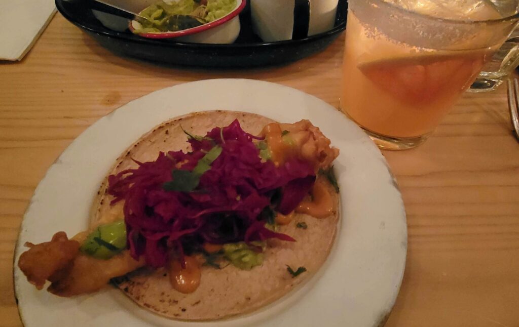 red cabbage and sauces on the beer battered haddock fish taco, Pescado Taco, from Campechano