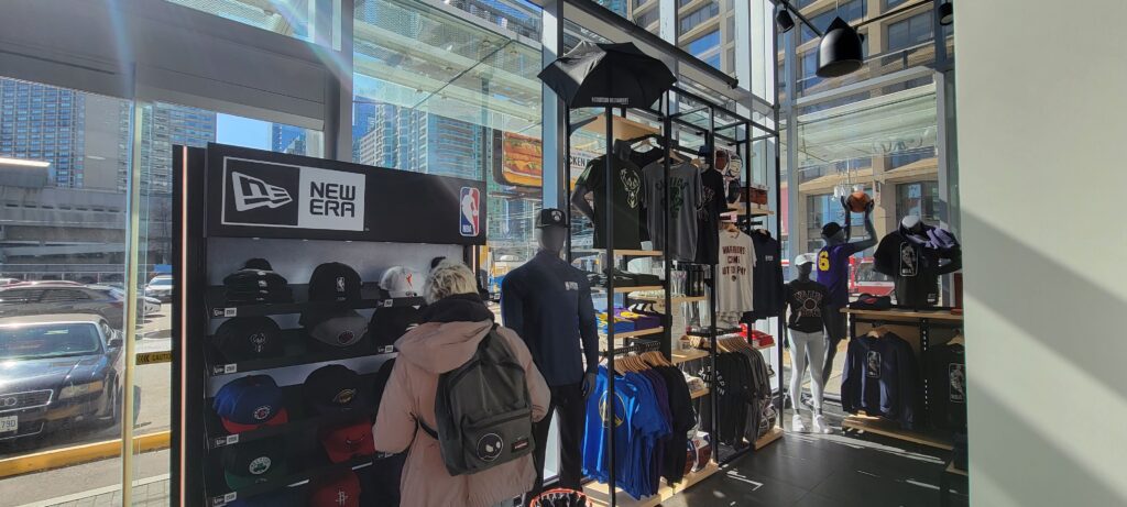 inside of the NBA store which sells hats and other merchandise.