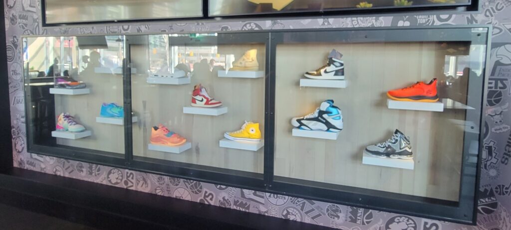 basketball shoes on the wall in display case