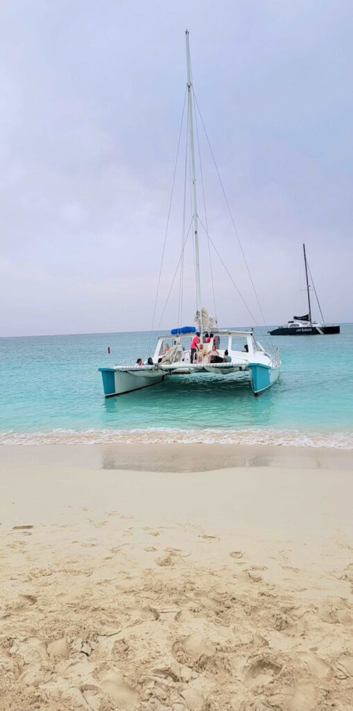 View of catamaran from the shore of Grace Bay Beach in Turks and Caicos.