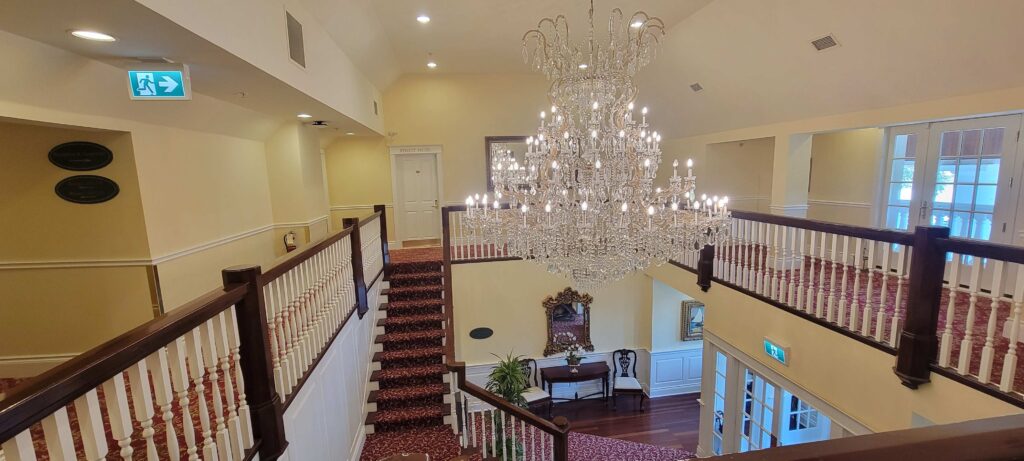 Interior of Riverbend Inn with beautiful chandelier.