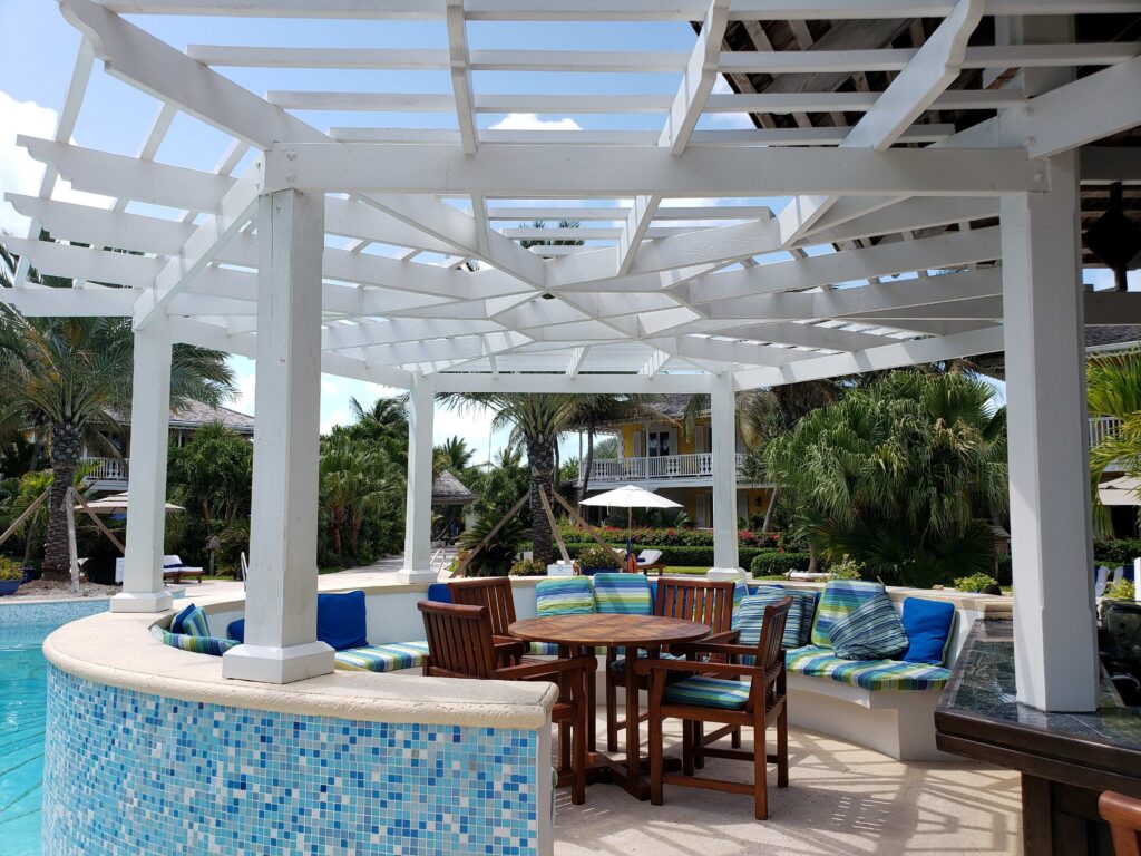 Casual nice seating to eat or have a drink by the swimming pool at Grace Bay