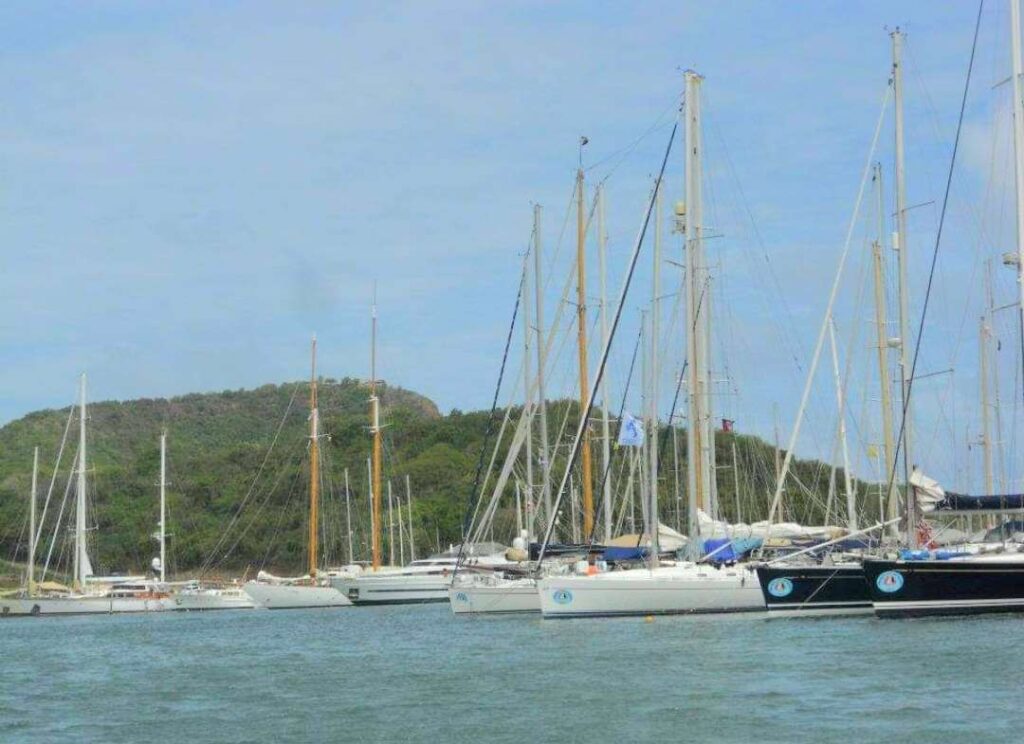 View of boats docked from our boat passing by Nelson's Dockyard on the Xtreme Circumnavigation tour in Antigua.