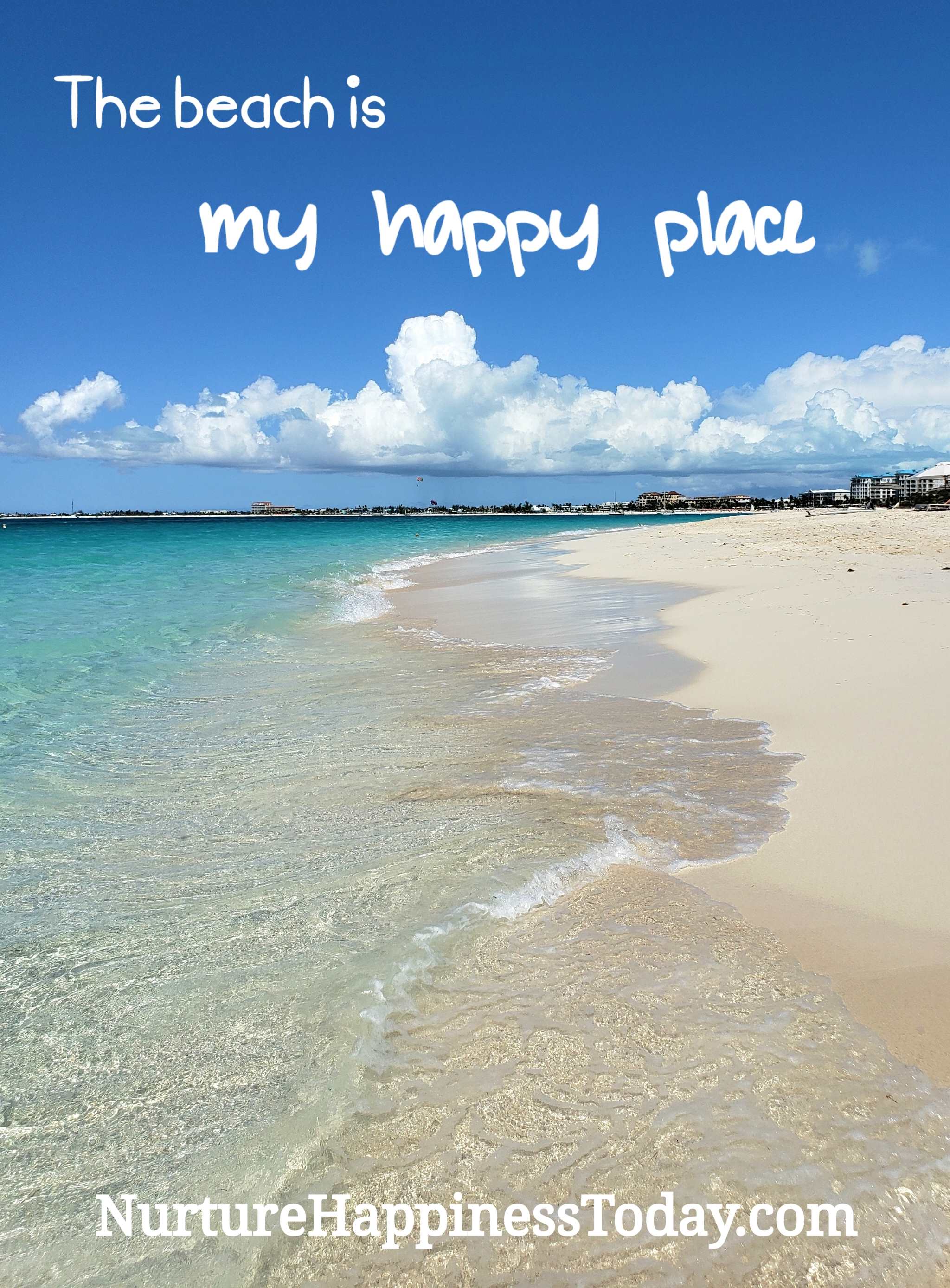 White sand beach and water up close with "The beach is my happy place"