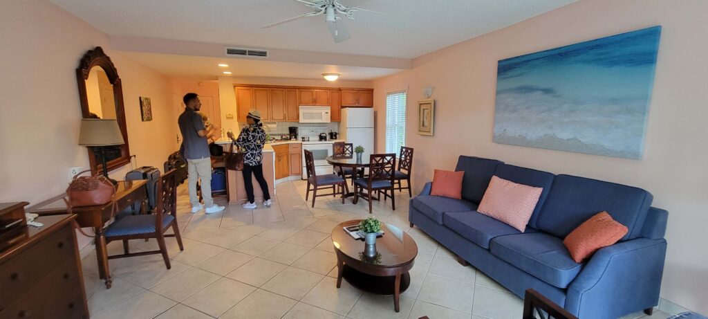 Living room and kitchen picture from one-bedroom suite at Royal West Indies Resort, Turks and Caicos.