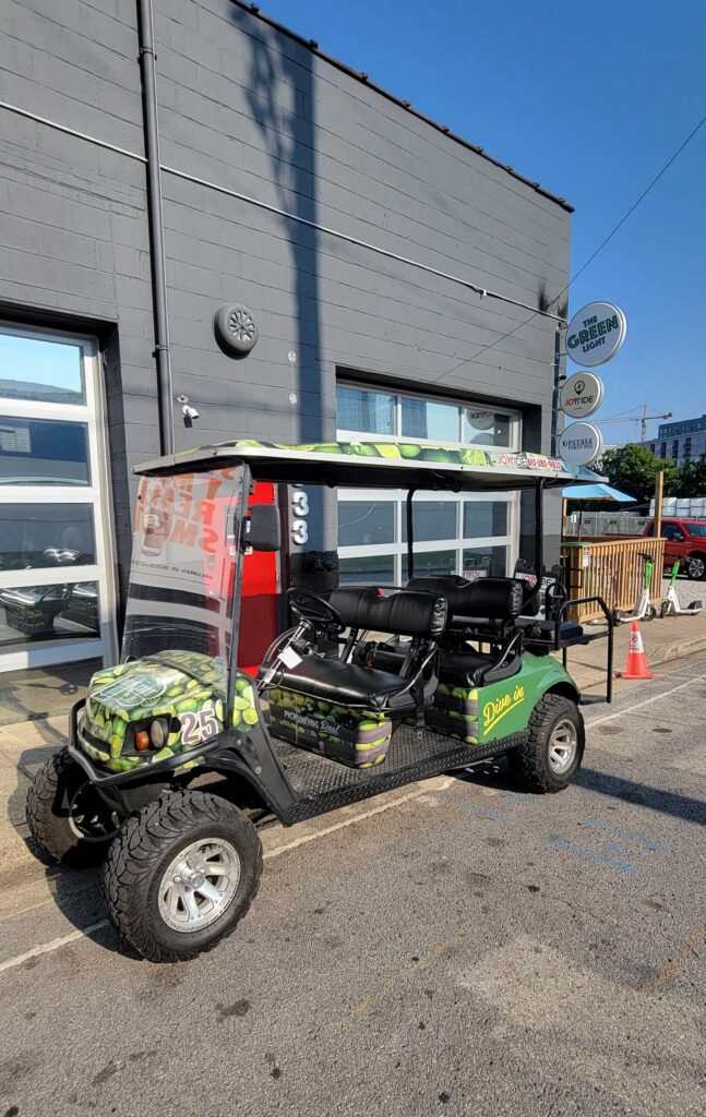 A parked golf cart used in the Nashville Golf Cart Tours.