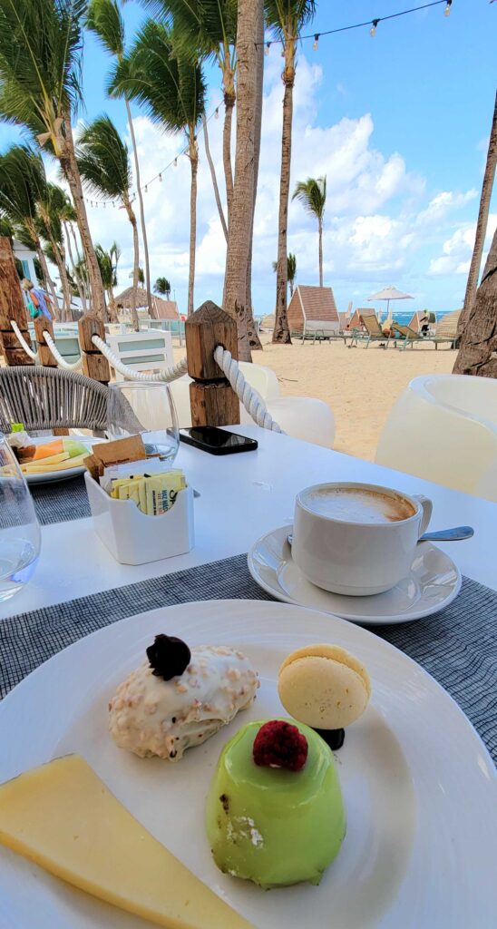 Having desserts and coffee outside by the beach at El Faro restaurant at Coral Level at Iberostar Selection Bavaro Suites.