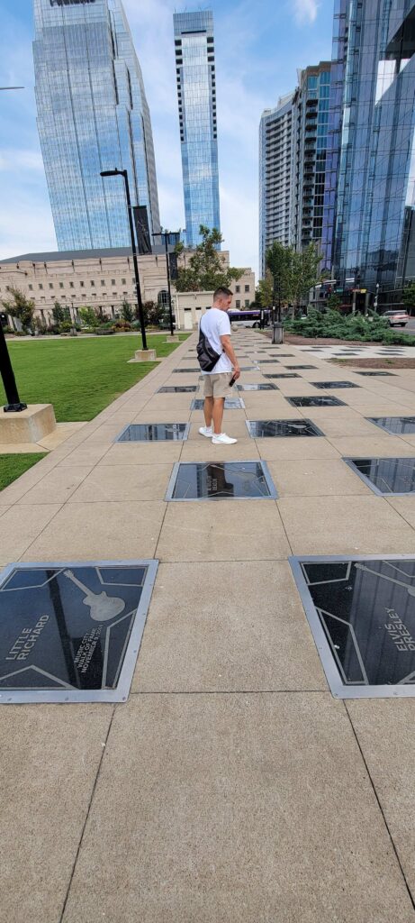 Man looking at Walk of Fame in downtown Nashville.