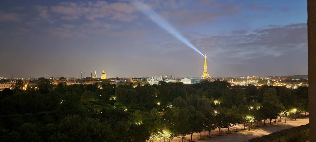 View from our "Deluxe Room Paris View" at Hotel Brighton Paris at night.