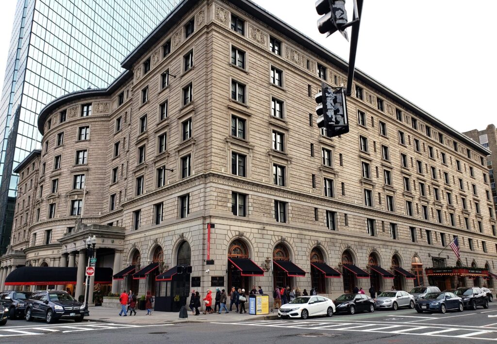 Exterior of Fairmont Copley Plaza Boston hotel during the day, from across the street.