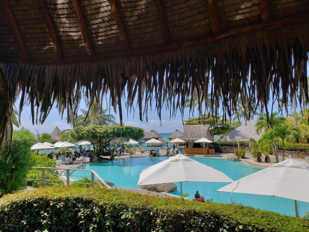 Outdoor pool at the Hilton Moorea Lagoon Resort & Spa during the day.