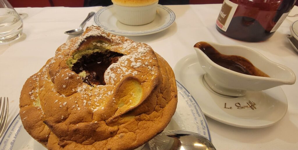 Pistachio souffle served with chocolate from Le Souffle restaurant in Paris.