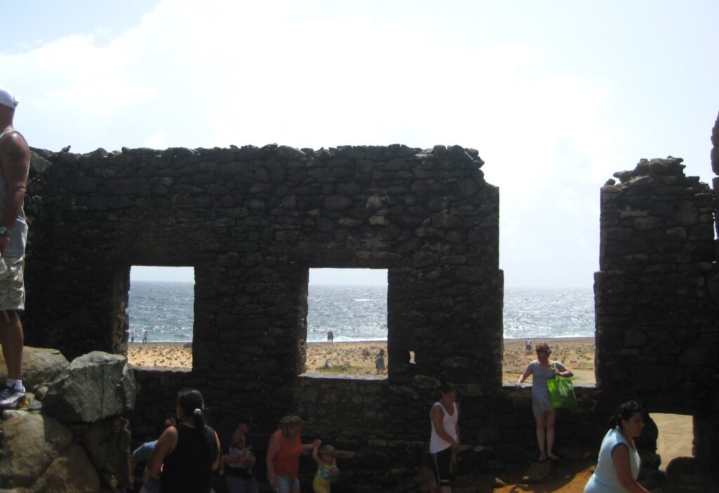 Section of the Bushiribana gold mill ruins with the water in the background; a stop during our Aruba jeep tour.