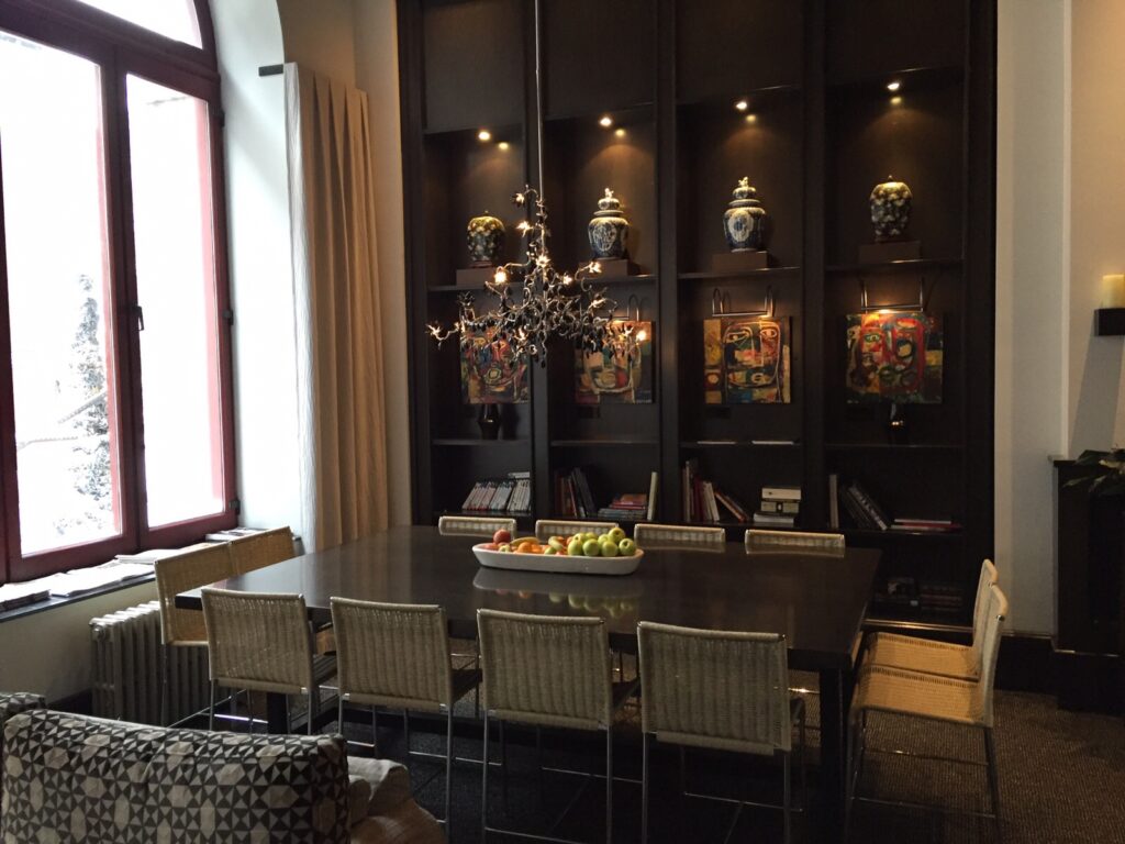 One of the dining and seating areas at the Hotel Le Germain Quebec with beautiful vases and decor along the back wall display.