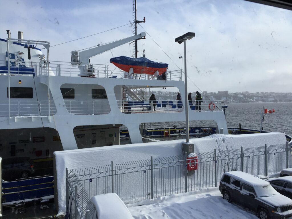 Picture of a portion of the Quebec City Levis ferry on a cold winter day, waiting to board.