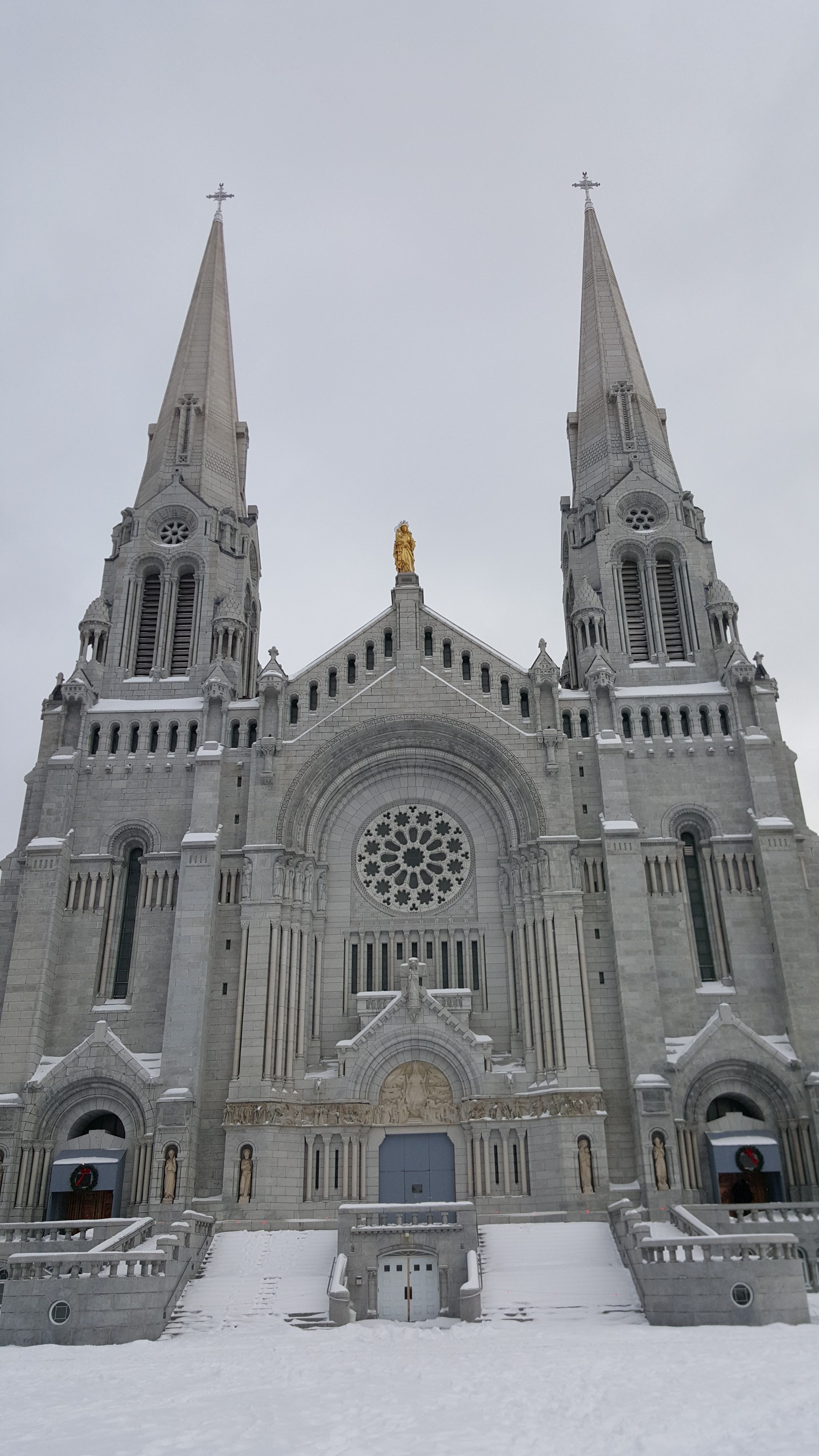 Entrance and exterior of the Basilica of Ste Anne de Beaupre in Quebec.