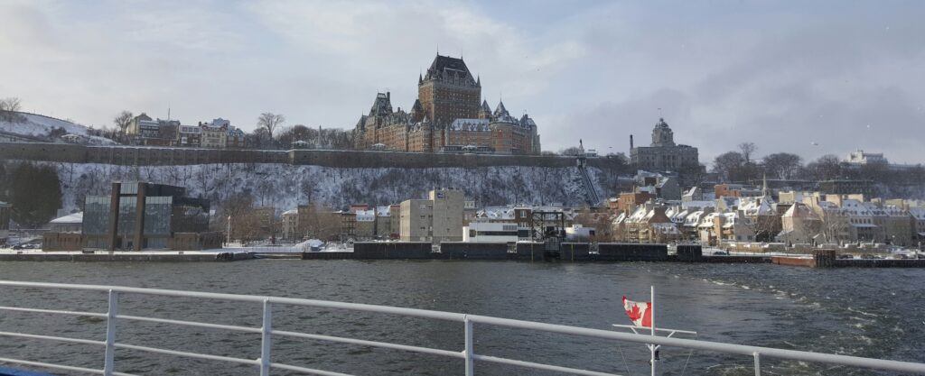 View from the ferry of the Fairmont Le Chateau Frontenac and and city on a winter day.