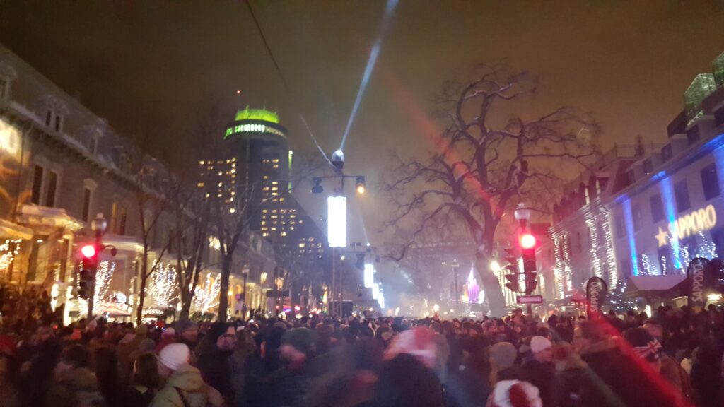 Crowds enjoying street party and festivities on Grande Allee after the New Year countdown are free things to do in Quebec City.