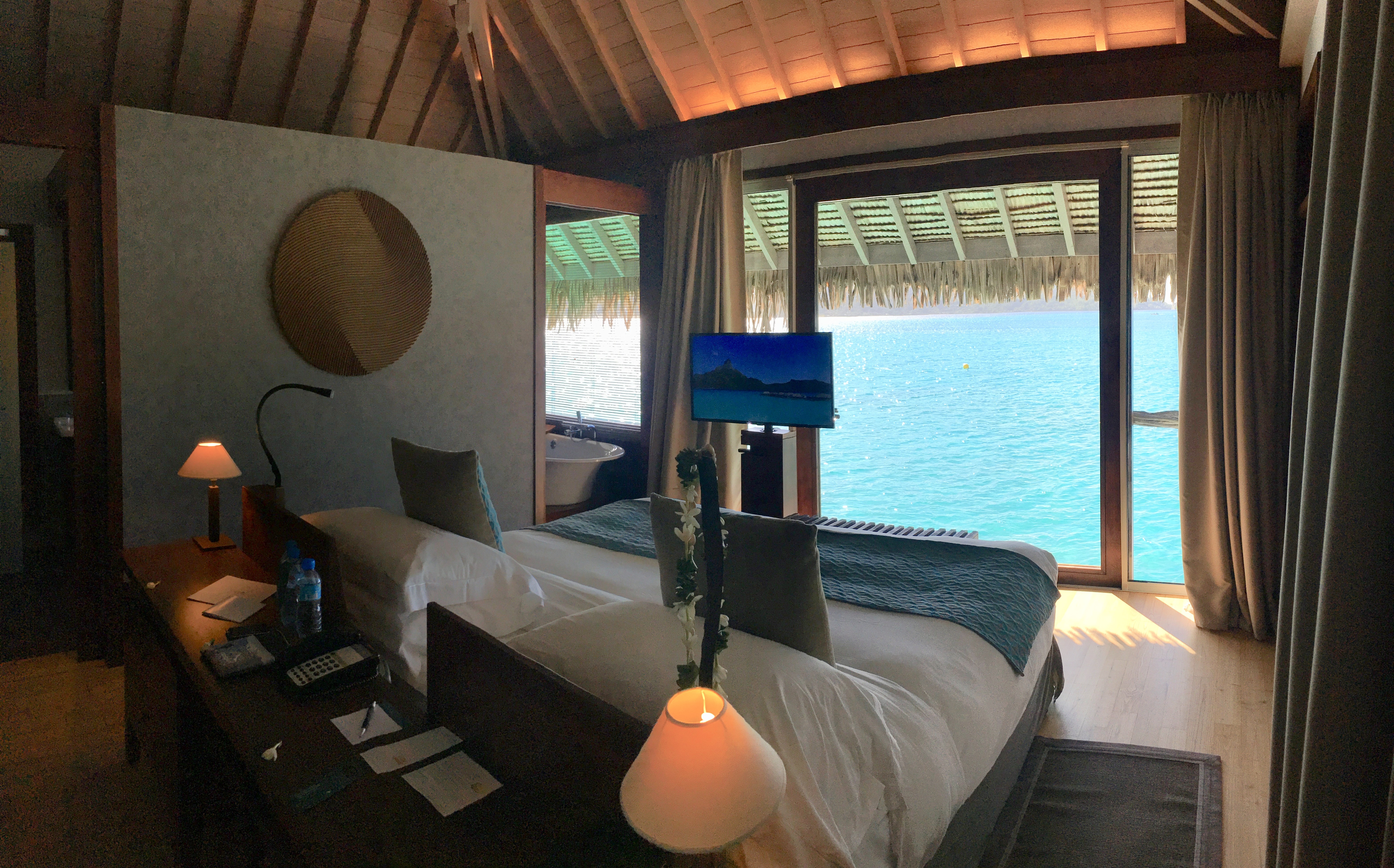 Picture of bedroom in our overwater vailla at InterContinental Bora Bora & Thalasso Spa, of bed and view of water.