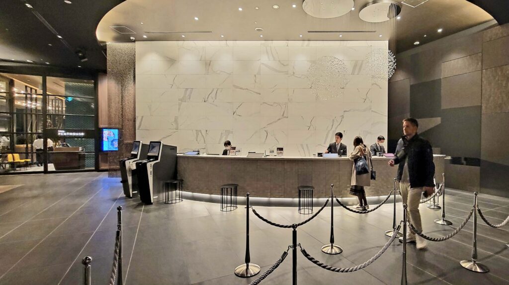 Reception area and 24-hour front desk at the Mitsui Garden Hotel Toyosu Premier.