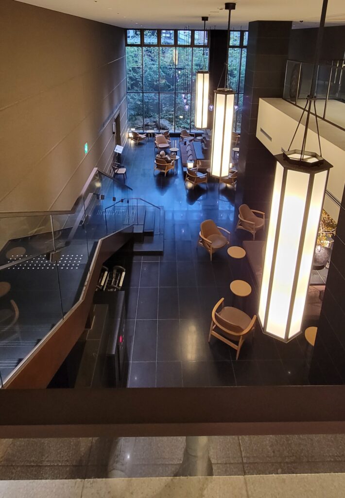 View of the interior and lobby of Hotel The Celestine Kyoto Gion taken from the top of the staircase.