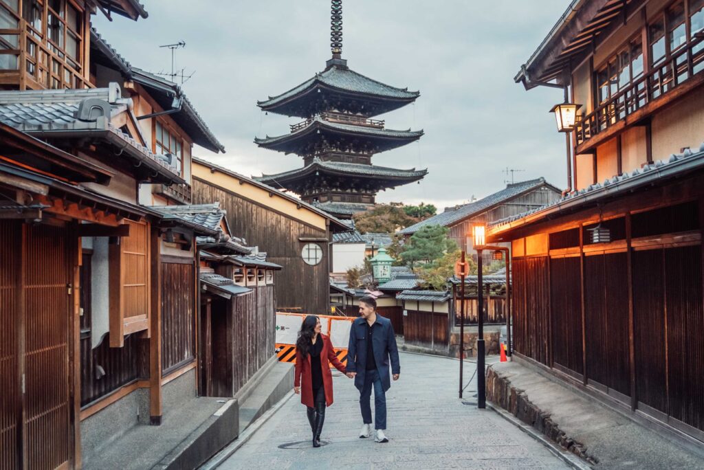 Couple walking in Sannensaka from vacation photo shoot in Kyoto for Flytographer